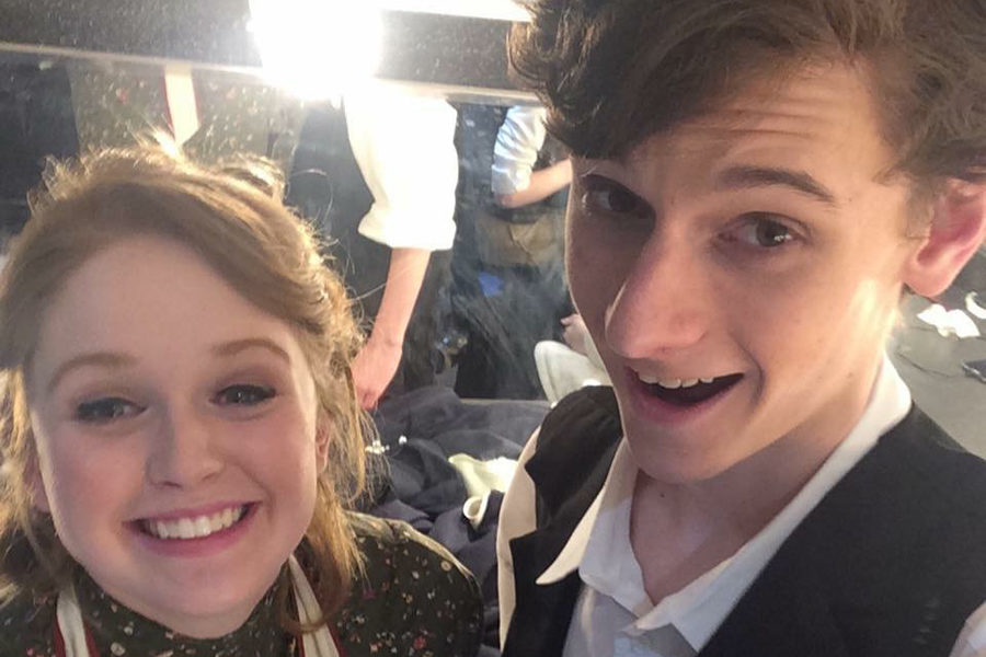 Smiling for a selfie with senior Drew Silverberg, junior Kathryn Harter prepares to go on stage for “Our Town” to play Myrtle Webb at Parkway West in 2015.