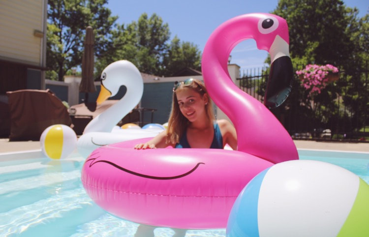 Sophomore Susie Seidel poses on a flamingo pool float for the about page of her blog. Seidel started the blog to build a portfolio for social media-related careers. I was really scared at first of what people were going to think, Seidel said. It’s just kind of one of those things where people are going to have an opinion no matter what, so you just have to do what makes you happy, and it does make me happy.