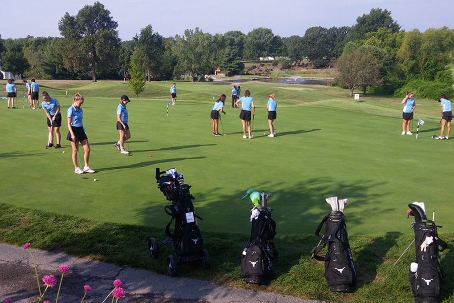 The varsity and JV teams practice putting before a match at Ballwin Golf Course. “Through our coaches incredible instruction and optimism about our team, we managed to improve so much as a whole team this year,” Suh said. “And I also feel like every single moment was fun. The team was so close and I can’t wait for next year.”