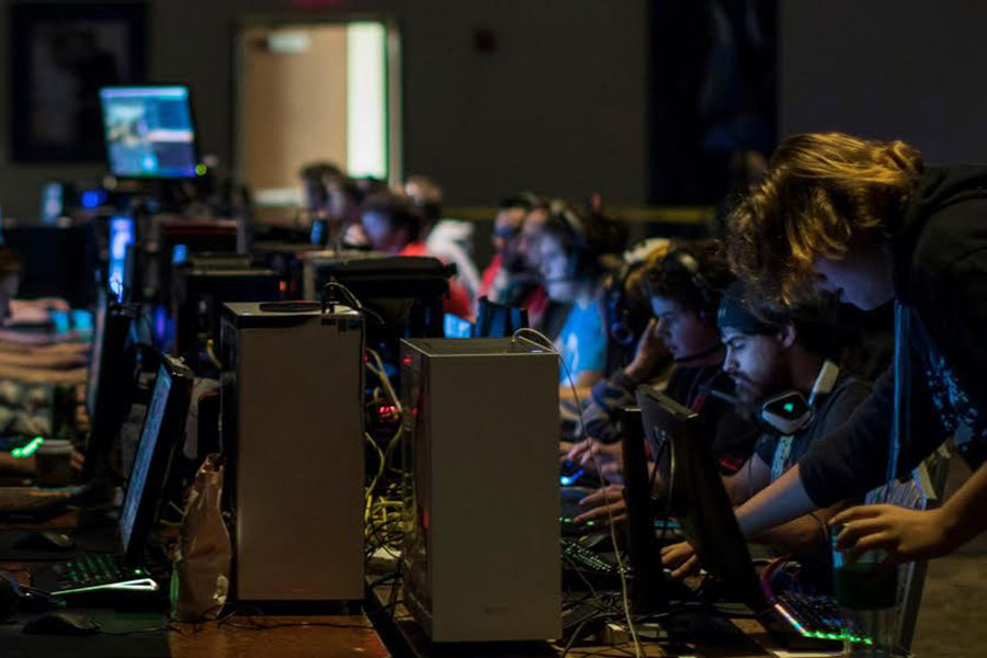 Senior Airi Murray leans over the keyboard while in the midst of an amateur competition. Murray hopes to one day join the big leagues with a team of friends. “You’ll have a [competition] and it’s almost like just friends hanging together with a prize pool,” Murray said.