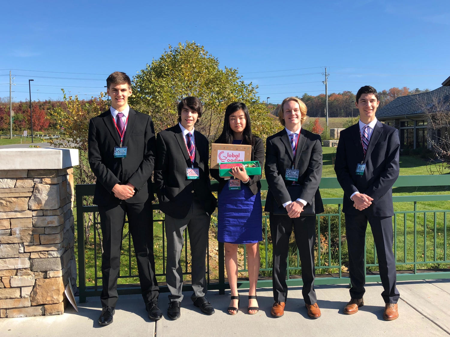 Global Goodies employees stand outside the LeConte Center at Pigeon Forge to get some fresh air before the oral presentation. The team placed first.