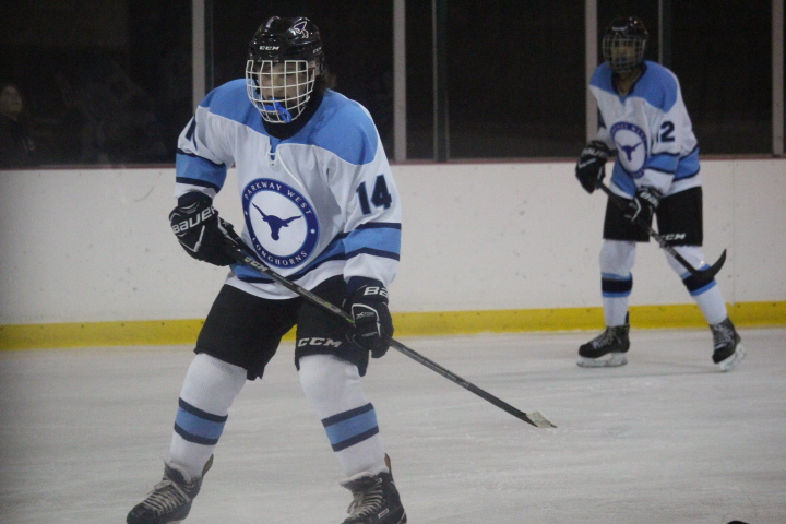 Freshmen Danny Talbott glides along the ice at his game against Northwest on Nov. 3. “The biggest challenge for me this game was the big crowd,” Talbott said. “I had to drown them out and just play.”