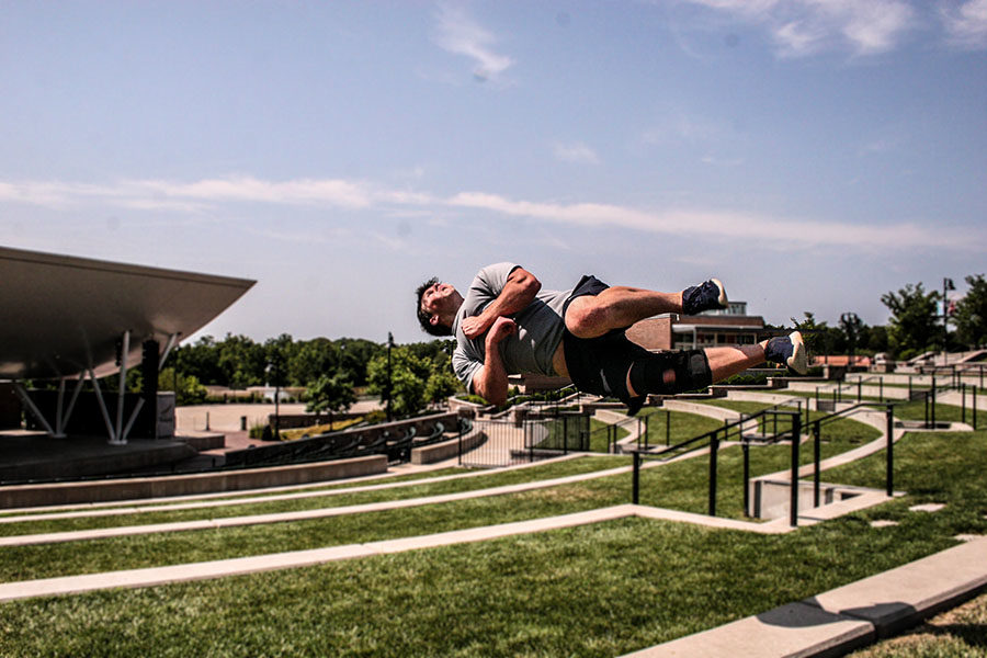 Senior Joe Roseman flips off a ledge at the Chesterfield Amphitheater for one of his training films. Roseman has been practicing parkour for six years. It’s still a really big stress reliever for me,” Roseman said. “Whenever I train, it just feels so natural.