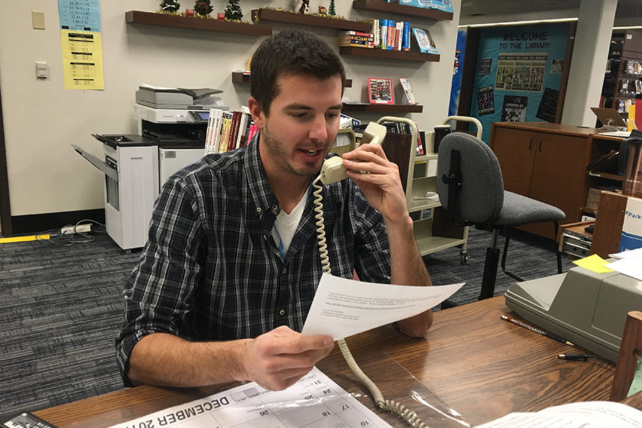 Teacher assistant Matt Tesson makes an announcement over the intercom. "My greatest challenge, so far, has been getting over my nerves of making the afternoon bus announcement to the whole school! [The] first few times were nerve wracking," Tesson said. “The best way to overcome any challenge is facing it head on.  I’m not nervous [making announcements] anymore."