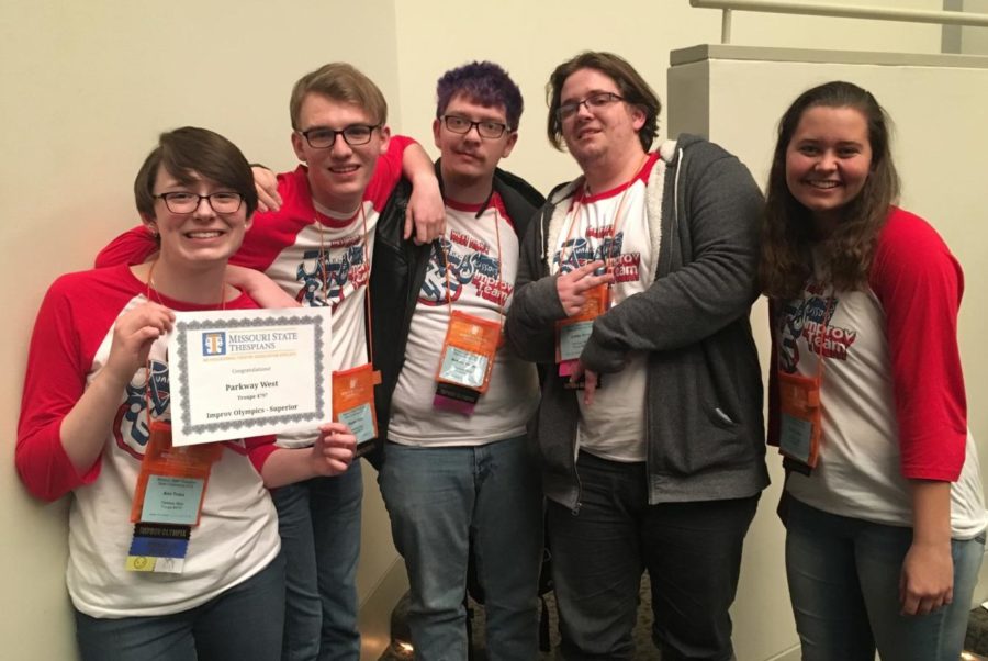 Wearing their “Running with Scissors” shirts, students from the improv team pose with the superior award they received, which is the highest rating. They were one of two groups in Missouri to receive this award for the Improv Olympix event. “We had a senior who was doing scholarship auditions, and four juniors who were busy too. We weren’t really expecting to do as well as we did,” Showers said.