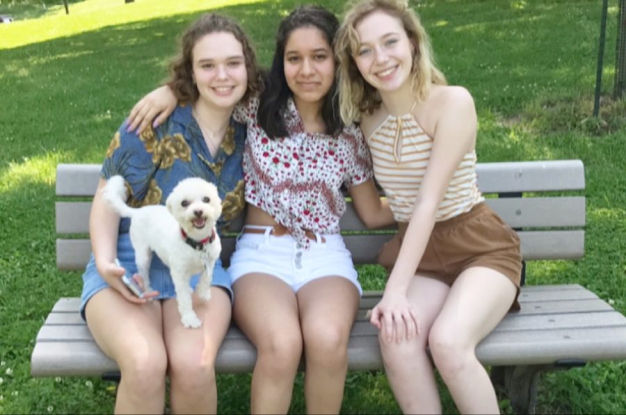 Enjoying the summer day, maltipoo Ruby smiles with juniors Juliane Pautrot, Megan Roberts and Kristin Priest. Roberts made an Instagram account dedicated to posting selfies of her dog. “Ruby’s very feisty and sassy, she has such an attitude,” Roberts said. “Ruby literally thrives off of socializing.”