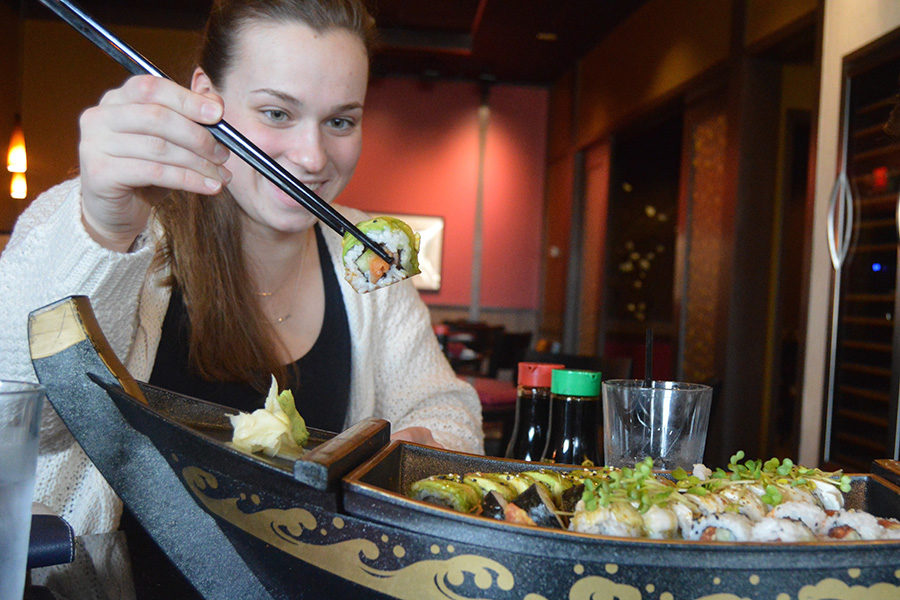 Staff writer Maria Newton enjoys sushi at Wasabi Sushi Bar. Wasabi’s menu features options from California Rolls to Teriyaki Chicken and has been voted St. Louis’s best sushi by Sauce Magazine for the past 13 years. “I had no problem finishing off four sushi rolls with just a couple friends to help,” Newton said. 