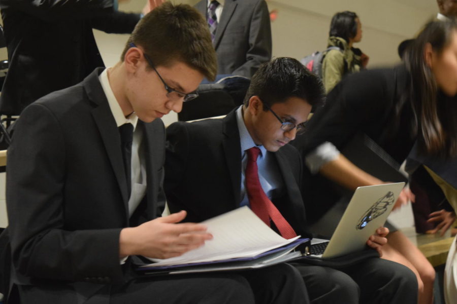 Freshmen Tyler Kinzy and Praveen Dharmavarapu work on their cases during free time in between rounds. Jefferson City High School hosted one of the last tournaments for debate teams around the state before districts. “I’ve done two tournaments so far and I’ve won first place at both of them, so it’s definitely been something surprising, especially to join this late in the season when everyone else has been [competing] for a while,” Kinzy said.