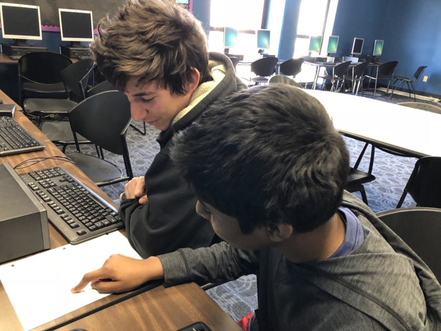 Freshmen Surya Jaladi and Caleb Levy brainstorm ways to increase their membership. "Not only did I have fun while I competed, but it also helped me learn more about the technology that we use everyday–like our laptops–so it helps me in the real-world too" Dean Petev. 