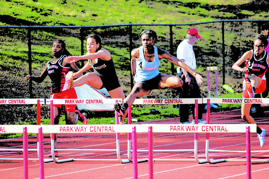 Clearing the hurdle, Williams-Harkins competes in a meet at Parkway Central. Williams-Harkins raced the 100 meter hurdles.“When the gun goes off, it is complete silence. I can’t hear anything. It is just a straight shot,” Williams-Harkins said.
