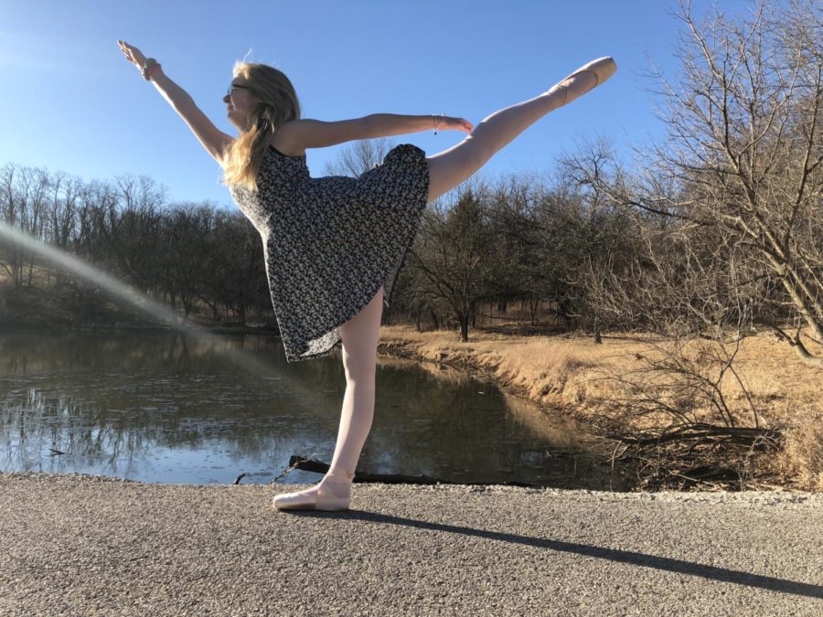 Maggie poses by holding her leg behind her in the arabesque position at Queeny Park. “I brought point shoes to the park to take pictures for our Instagrams,” Lyerla said. “Sometimes I do lyrical improv at home and I work on pointe alone because I have to keep up with my strength because my ankles are hypermobile.”
