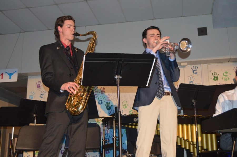 Senior Jonah Hathaway and junior Noah Wright perform at the Jazz Coffee House concert. Both students are members of the jazz band led by band director Brad Wallace and choir director Brian Parrish. “Jazz was a genre of music that I wasn’t familiar with,” Wright said. “Being in Jazz Band has made me a better musician and has helped me to enjoy music even more.”