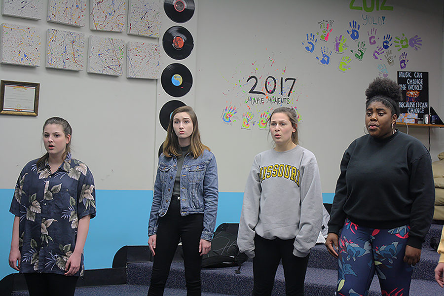 Sarah Pennell, Kennedy Brown, Sophie Ellis and Skyla Faber, along with the rest of Jazz Choir, rehearse a song for the New York Voices Festival. Among their set are arrangements of ‘California Dreamin’,’ ‘We Found Love,’ ‘Shiny Stockings’ and ‘Singin’ in the Rain,’ along with a piece titled ‘The Awakening.’ “I’m excited to perform ‘California Dreamin’.’ There are a lot of cool rubs and half step movements that sound really awesome when we have them together,” senior and jazz choir member Mitchell Vierling said.