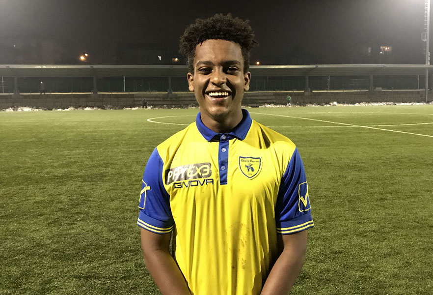 Alumnus Leul Mesfin smiles at the camera after playing a game in the Bottagisio Sport Center in Verona, Italy.
