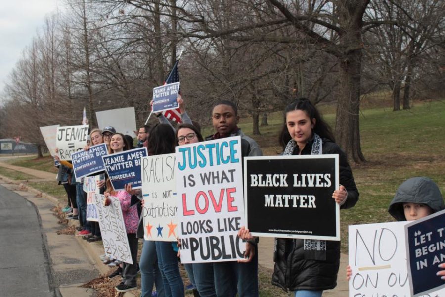 Rallying across the street from the Parkway School Board Candidate Forum at the Islamic Foundation of Greater St. Louis, Parkway students, parents and alumni share signs that address white supremacy on the Board of Education. Students also protested and talked to voters at polling sites April 3 to help spread their message. “At about eight different locations, [students] protested basically all day, holding up signs, talking to voters and making sure that they knew to make an informed decision,” senior Cheryl Ma said.