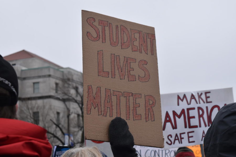 A citizen holds up a sign at the March For Our Lives STL event on March 24. Starting at Union Station, participating citizens marched down Market Street toward the Arch. “[The march] allowed us to be vocal. It allowed us to grieve, but it also allowed us to feel powerful,” sophomore Campbell Stewart said.