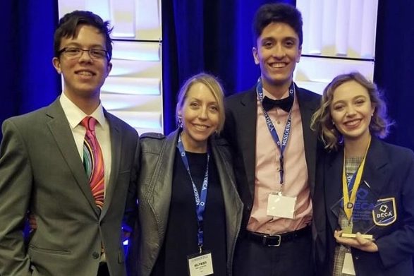Juniors Tony Galanti, DECA Sponsor Holly Weber, Caleb Canatoy and Kristin Priest finish competing at the State DECA competition in Kansas City. Weber helped Priest prepare for each of her competitions through online practice. “I hope that I medal, but just the fact that I’m qualified is pretty awesome,” Priest said. “So, whatever I do I’m glad that I’ll be there. I will be there for six days by myself, so it will be a good learning experience.” 
