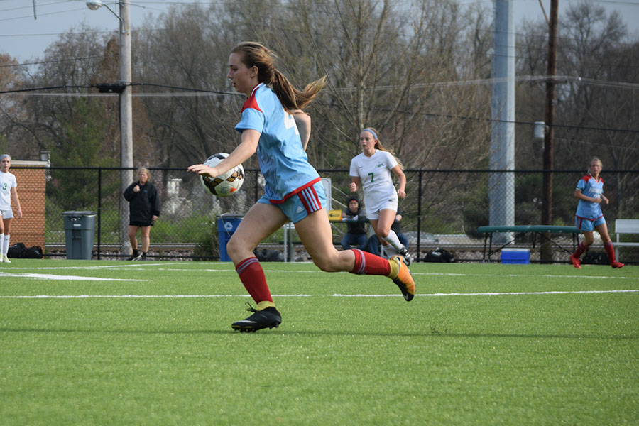 Freshman Leah Selm settles the ball against Nerinx Hall April 13. Nerinx defeated West 0-2. “It was a good game. I thought our team played really well and put up a good fight,” Selm said.