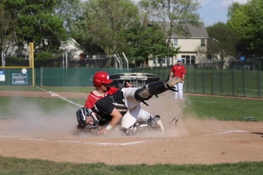 Senior Jack Swiney slides into home plate in a league game against Lafayette. Parkway West won with a final score 18-8 on May 9. “Senior Trevor Abney got a base hit up the middle. The center fielder on the other team threw it home as I was sliding into home plate, so there was a play there,” Swiney said. 