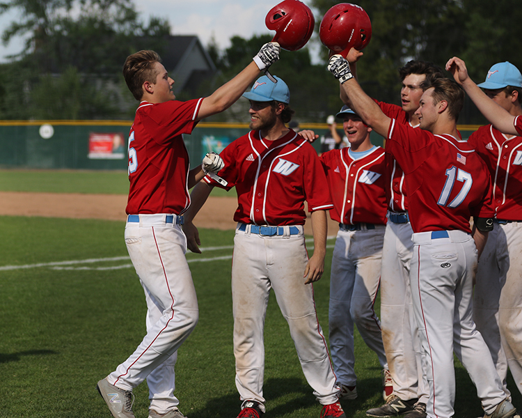 Celebrating an 18-8 victory over Lafayette May 9, the varsity boys baseball team cheers on sophomore pitcher Tyler Purdum for hitting two home runs. Along with the win against Lafayette, the team made history May 1 by winning their first conference title in over 15 years. “[The win] is a big boost going into districts this weekend,” junior outfielder Parker Adams said. “We’re confident because we just beat [Lafayette], so hopefully we’ll be able to win the district title and move on the the state tournament.”