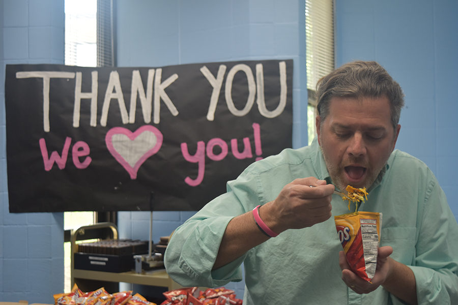 Social studies teacher Mel Trotier enjoys walking taco at the Friday, May 11 teacher appreciation taco bar.