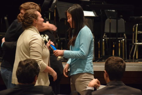 With a trophy in hand, speech and debate coach Cara Borgsmiller congratulates senior Cheryl Ma. She alongside fellow senior Ryan OConnor qualified for the 2018 National Speech & Debate Tournament in public forum debate after going undefeated at the Eastern Missouri district tournament. “It was really exciting. It was different than it is for most people because Ryan and I were undefeated the whole tournament, so they decided [we qualified] automatically even before the actual awards were announced since we were the only undefeated team,” Ma said. “We found out before the actual awards ceremony, so it relieved a lot of pressure because usually people are very anxious during awards.”