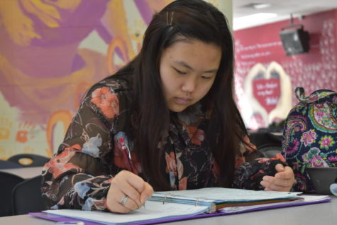 Working on a math problem during study hall, senior April Pak prepares for the AP Calculus Exam. AP exams take place from May 7 through May 18, while finals go from May 22 to May 25. “I study a little bit everyday leading up to the finals or the AP exam,” Pak said. “A good [way to study] is to buy an AP review book and maybe go through a set number of pages or a chapter every night. It’s really helpful.”