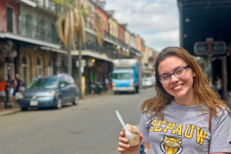 Ice cream in hand, junior Caroline Dunn enjoys the vibe of New Orleans. Students had personal time to explore and embrace more of the city. “It was cool to see the influence and history that shaped the abundant culture of New Orleans,” Dunn said.