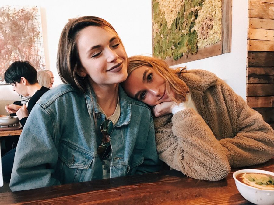 Sophomore Caroline Judd leans against her sister, alumna Emily Judd, while out for lunch.