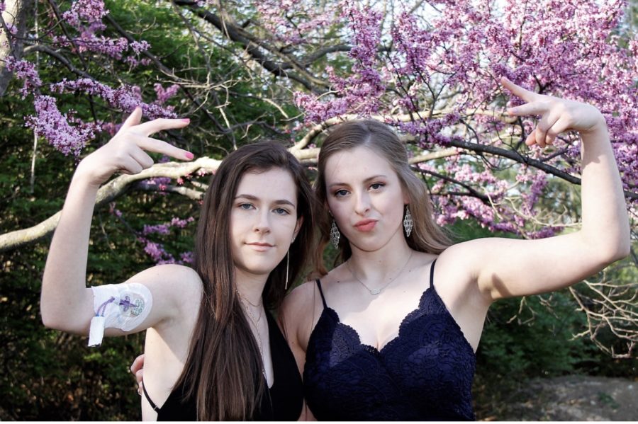 Posing with a port on her arm, seniors Stephanie Ingberg and Lauren Lashly have fun taking Prom pictures. Despite Ingberg’s ongoing health obstacles following her illness, she and Lashly wanted to make Prom night special. “I knew that Prom was really important to Stephanie. It helped motivate her and gave positivity during her recovery process,” Lashly said. 