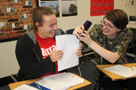 Seniors Erin Puhan and Ann Truka attempt to staple an essay in their AP English Literature and Composition (AP Lit) class. AP Lit is the senior honors option English course. “I think English is very collaborative,” AP Lit teacher Andria Benmuvhar said. “You read together, you talk together, and, apparently, you staple essays together.”