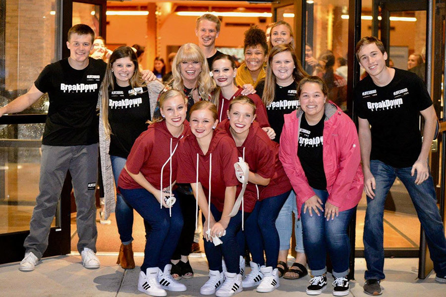 A group of friends, including senior Joe Roseman, who are involved in BreakDown smile for a photo after a community performance. At community performances, anyone can come watch BreakDown perform, and Roseman was on the greeting committee for that performance. “Before BreakDown I had anxiety with [meeting new people],” Roseman said. “But it’s an excellent fostering leadership program and has helped me to take on those roles more easily.”