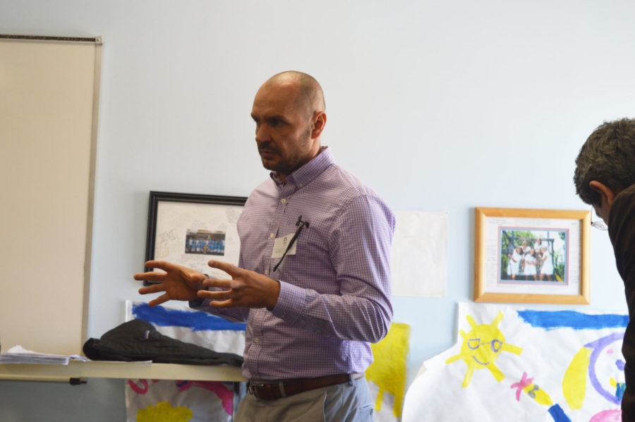 Explaining history while describing his own culture, Dennis Nasufovic speaks to social studies teacher Jim Hermann’s class. Nasufovic immigrated to St. Louis with his family in the 1990s where there is a current large Bosnian population. “If you have a neighbor who is very loud watching the soccer game with a broken TV set outside, you know its a Bosnian whose team lost,” Nasufovic said. 