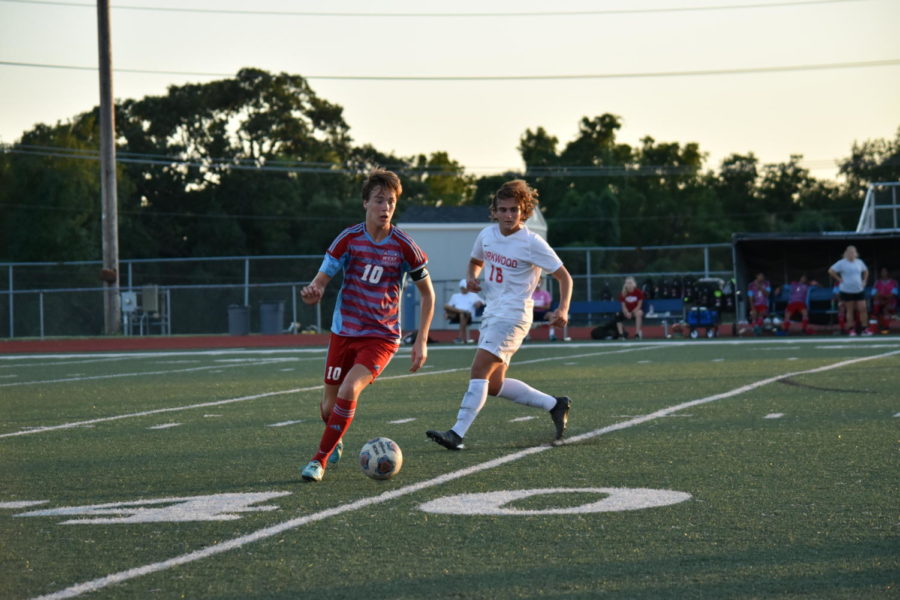 Cutting away from a Kirkwood player, senior and varsity defender Dylan Zurweller dribbles the ball down the field. The team went into overtime against Kirkwood Aug. 28 and ended the game with a score of 1-0. “We’re actually pretty used to [going into overtime]. Last year we went into overtime a lot, so we have a lot more experience with that, and we were pretty comfortable,” Zurweller said. “We used to not score at all, but throughout this season [our goal is] to start scoring a lot more.”