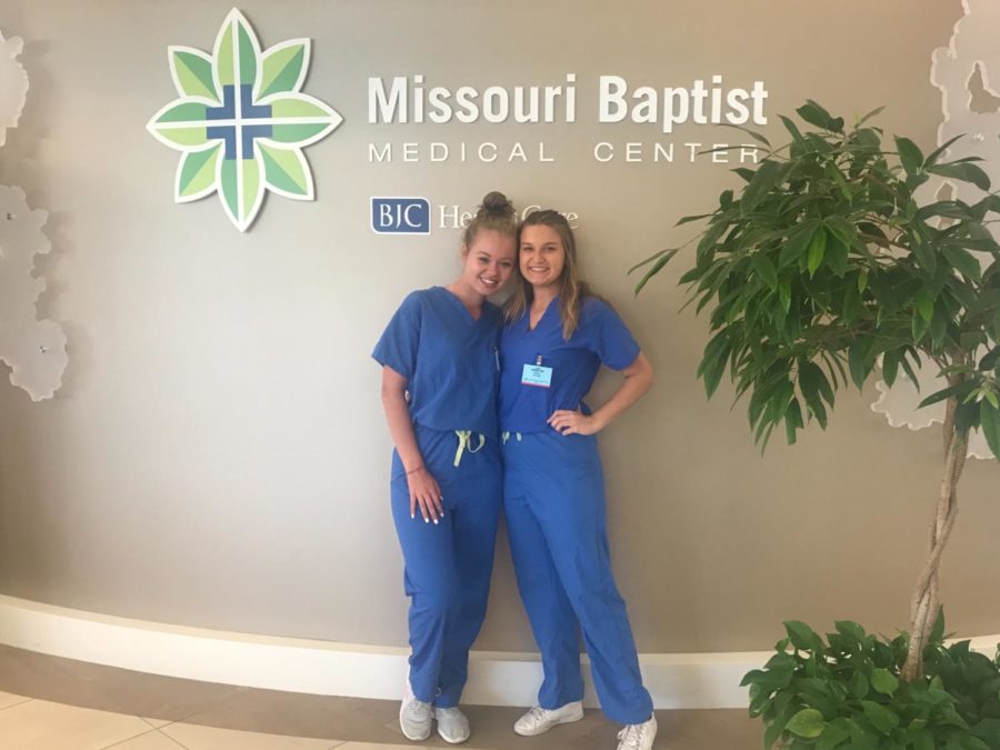 Dressed+in+dark+blue+scrubs%2C+juniors+Mckenna+Bendle+and+Kristin+Wilson+get+ready+for+a+day+of+work+at+the+Missouri+Baptist+Medical+Center.+Bendle+worked+in+the+Post-Anesthesia+Care+Unit+%28PACU%29+while+Wilson+volunteered+in+the+Outpatient+Surgery+Unit.+%E2%80%9CThe+most+rewarding+part+is+actually+seeing+the+how+the+nurses+and+surgeons+are+able+to+take+a+patient%2C+perform+surgery+on+them%2C+and+help+them+in+a+way+that+they+couldnt+do+themselves%2C%E2%80%9D+Wilson+said.+%E2%80%9CSeeing+the+way+patients+are+so+happy+when+they+find+out+the+surgery+went+just+as+planned+and+that+they+are+on+their+way+to+a+successful+recovery+is+so+outstanding.%E2%80%9D