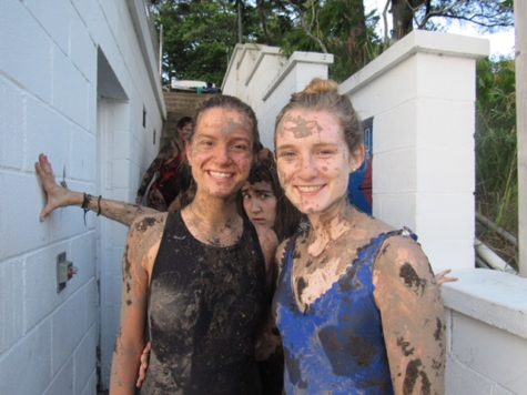 Covered head to toe in mud, senior Harper Stewart poses with a cabin mate after venturing out to a nearby swamp. Along with spontaneous mud wars, campers went wakeboarding, jet skiing and practiced their archery skills. “One of my favorite memories would be having a mud war. It looked like a scene straight out of ‘Shrek,’” Stewart said. “I had algae and mud stuck in my ears for the next week.”