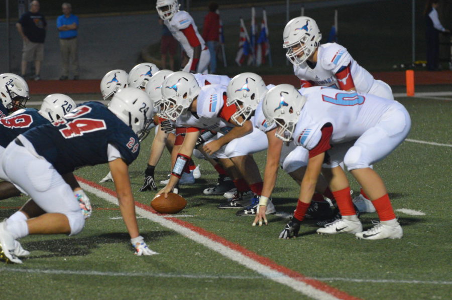 Taking the snap, senior quarterback Collin Krewson prepares to run the play. Parkway West defeated Parkway South 35-0 in the first game of the season.