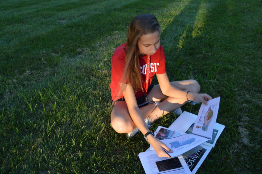 Junior Lauren Beard reads weather pattern graphs after attending an Earth Sciences camp this summer. At the camp, Beard explored her passion for meteorology with students from all over the United States. “[I] thought it was a great opportunity to see if this is something that I’m really interested in, Beard said. “I’ve just found myself drawn to that subject, I’ve always just found it really interesting. 