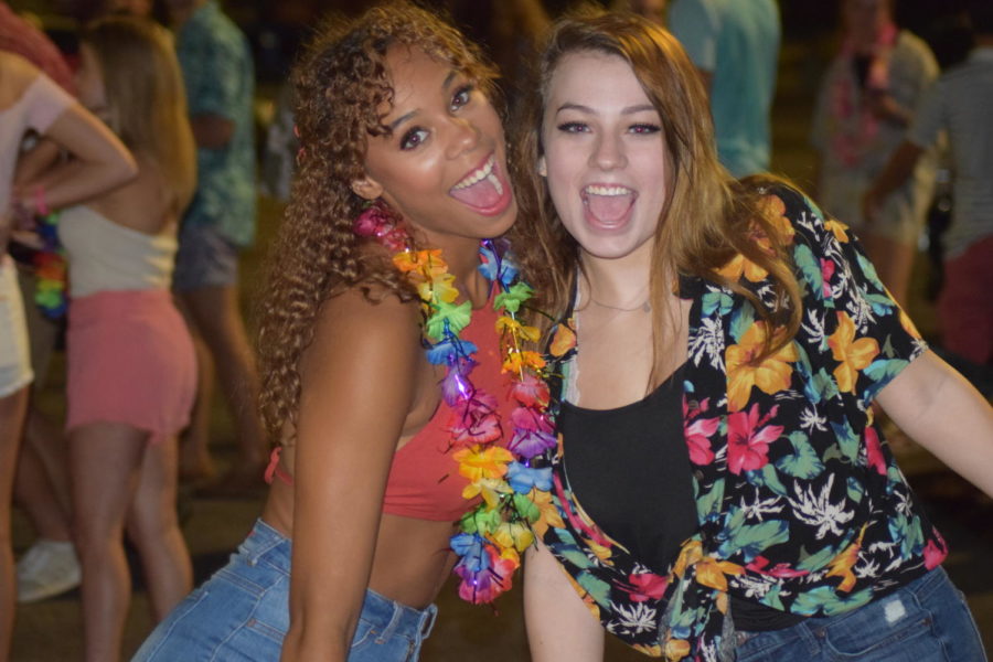 Supporting the tropical theme, senior Madison Terry and Alyssa Stopke wear the leis and Hawaiian shirts they bought the night before at Party City. “I had a lot of fun getting dressed up in tropical wear. We went to a couple stores and bought a bunch of Hawaiian wear as well as thrift shopping, so it was for sure an adventure,” Terry said. 