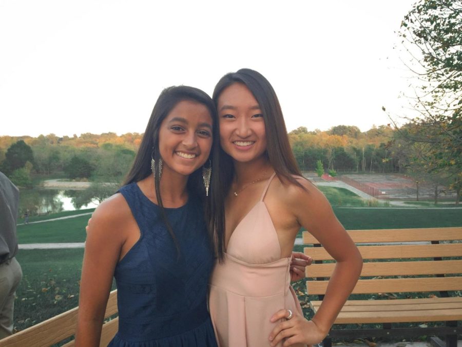 At last year’s Homecoming, juniors Anjali Shah and Ashley Chai sport their new dresses at Queeny Park. Chai bought her dress from Tobi.com for $24. “Tobi literally has the same dresses every year, so finding a dress I like for an affordable price [is the most difficult thing about Homecoming],” Chai said. “I look for websites that aren’t sketchy and brands I know I can trust.”