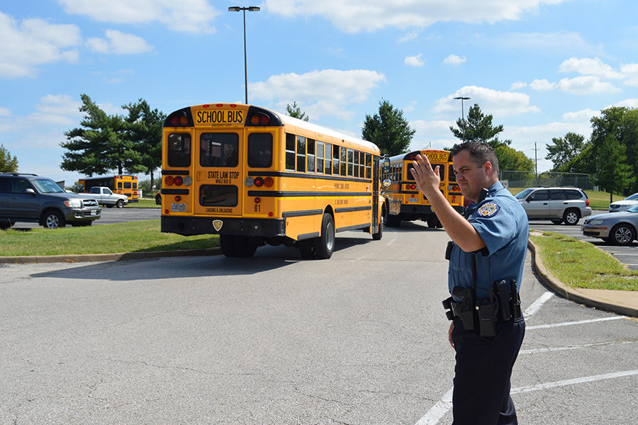 Student Resource Officer Zeus Hernandez directs traffic in the parking lot. Hernandez has been working as an SRO for the past five years, but this is his first at West. “Like any profession [in police work], you are always aspiring to do different things, better things,” Hernandez said. “I love my job.”