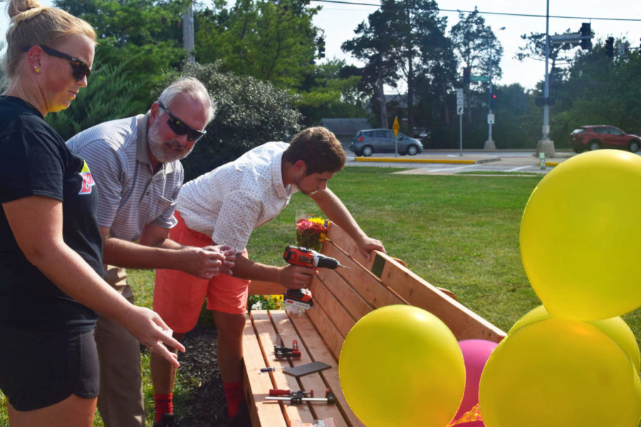 Drilling a plaque into the bench he built, junior Matthew Hopper puts the final touches on his Eagle Scout project during girls tennis senior night in order to honor Brynn Haun. Because he had known Haun since elementary school, Hopper’s troop notified him about building the bench, and he enlisted junior Andrew Jolly and senior Gabe Rennard to help him. “It was important to me because I just wanted to give back to a community that was hurting,” Hopper said. “Brynn has given so much to the community just from always being supportive, nice and so positive, even when she was going through her toughest times, so I wanted to give back.”