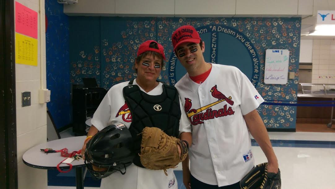 Kitty Strong poses with Mario Pupillo on Cardinals Day. The two have worked each other for four years. “Kitty and I have a very close relationship and I know she will bring great success to her new position,” Pupillo said. 