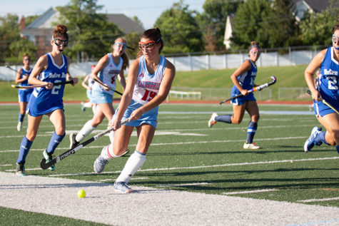 In a varsity game against Notre Dame High School, senior forward Olivia Riemer runs the ball down the sideline. The team is preparing for the post season tournament beginning Oct. 22, where they hope to finish among the top 16 teams in the state, something they have never accomplished. “We are working in practice on playing with more intensity and having good transfers as we get ready for the end of the season,” Riemer said. 