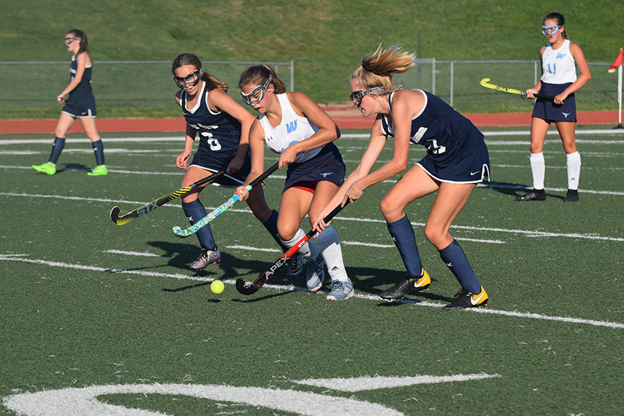 Fighting for possession of the ball, freshman forward Mira Nalbandian dribbles away from the other team in a JV game against Notre Dame High School Sept. 5. Nalbandian joined the field hockey team after attending the high school field hockey camp during middle school. “I have improved so much on my stick work and I have been working on perfecting my shot,” Nalbandian said.
