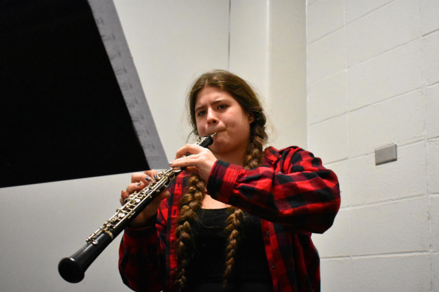 Practicing during school, senior Gwyn Allendorph works on music for an outside ensemble. One of her most impactful moments in music was listening to melodies in the strings during a performance of the Peer Gynt Suite at Powell Hall. “One of my favorite pieces of all time to play is Donzón no. 2 by Arturo Márquez, that was the first piece we ever started rehearsing in the YPCO in my first year,” Allendorph said.