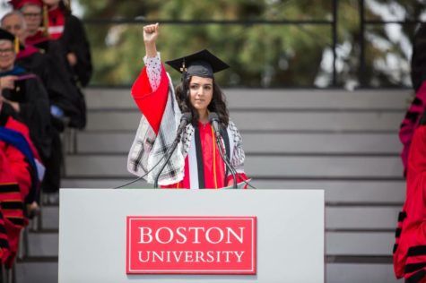 After punching her fist into the air for the Black Power Movement and the Palestinian Crisis, alumna Yasmin Younis receives a standing ovation from the audience after her speech came to an end. Younis was chosen to give the commencement speech out of five other finalists after presenting to a committee. “I couldnt believe that people out there thought I was as inspirational as some incredible people,” Younis said. “Just to be recognized and compared to them is such an honor.”