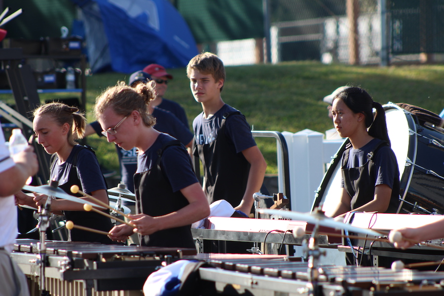 Junior Aim Achalapong plays synthesizer at the Edwardsville Tiger Ambush Classic Marching Band Festival. Achalapong learned to play piano in Thailand and decided to join the marching band for the year she was here. "In Thailand, if we don't know someone, we won't talk to them," Achalapong said. "Here, a lot of people I don’t know still talk to me. People are very friendly here and it makes me feel welcomed."