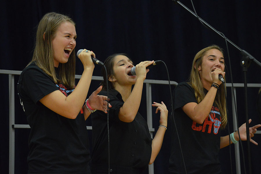 Senior Meghan Stanfield, junior Theresa Monteleone and senior Chloe Hershenow perform enthusiastically in Jazz Choir at the First Annual Music Department Showcase Concert. This is Stanfield’s second year in the ensemble. “Singing is my passion, and it’s so nice to come to class to just sing with all my friends,” Stanfield said. “It really helps me forget about all the chaos of the world.”