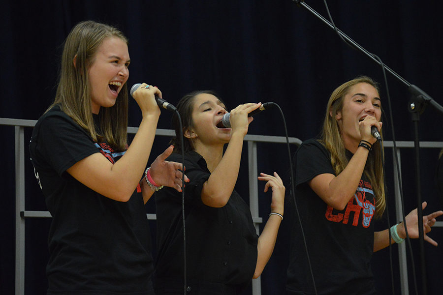 Senior+Meghan+Stanfield%2C+junior+Theresa+Monteleone+and+senior+Chloe+Hershenow+perform+enthusiastically+in+Jazz+Choir+at+the+First+Annual+Music+Department+Showcase+Concert.+This+is+Stanfield%E2%80%99s+second+year+in+the+ensemble.+%E2%80%9CSinging+is+my+passion%2C+and+it%E2%80%99s+so+nice+to+come+to+class+to+just+sing+with+all+my+friends%2C%E2%80%9D+Stanfield+said.+%E2%80%9CIt+really+helps+me+forget+about+all+the+chaos+of+the+world.%E2%80%9D